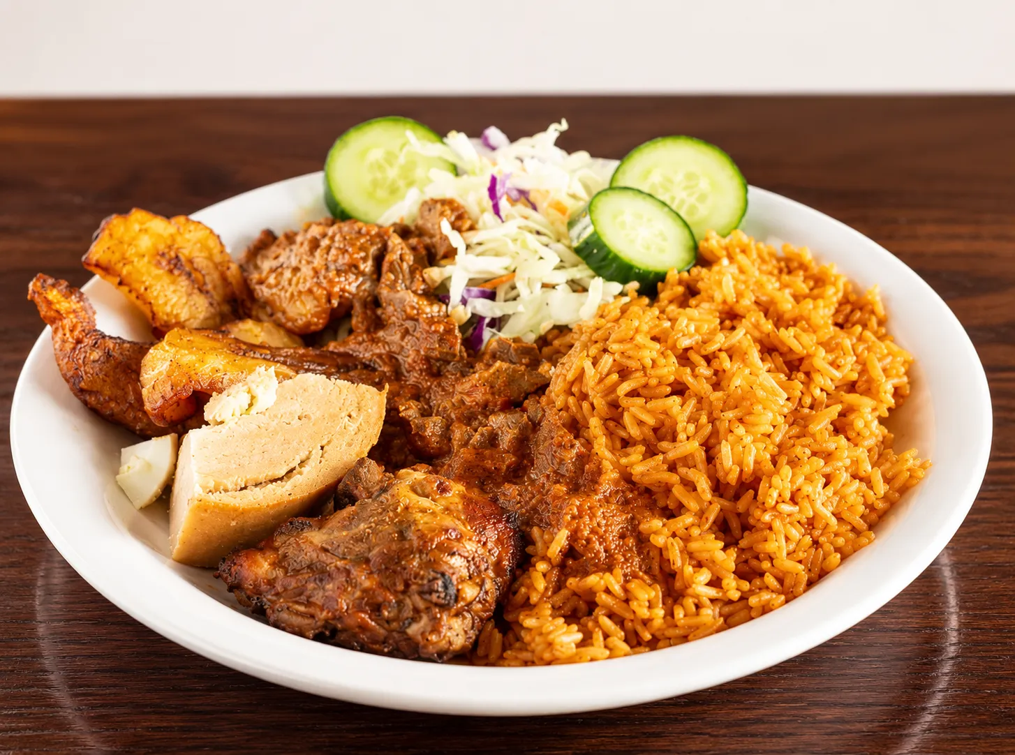 Akin's African Restaurant signature dishes - Jollof Rice, Pounded Yam with Egusi Soup, Suya and traditional West African food in Winnipeg